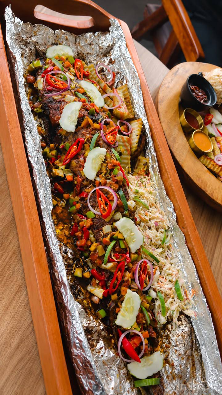 The Royal Board — full-length grilled catfish loaded with peppers and coleslaw